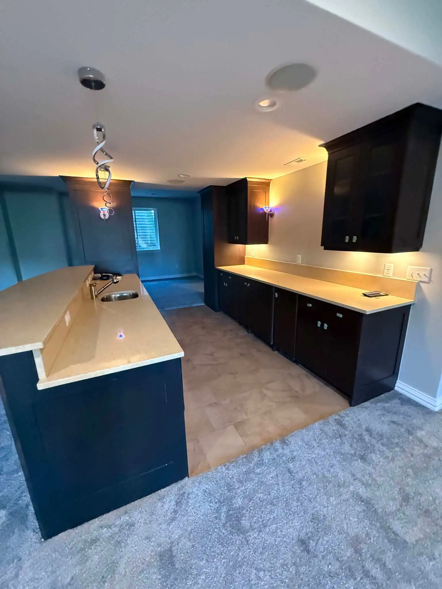 Home Remodeling in Denver 10 Modern-kitchen-with-dark-cabinets-and-island_denver Colorado